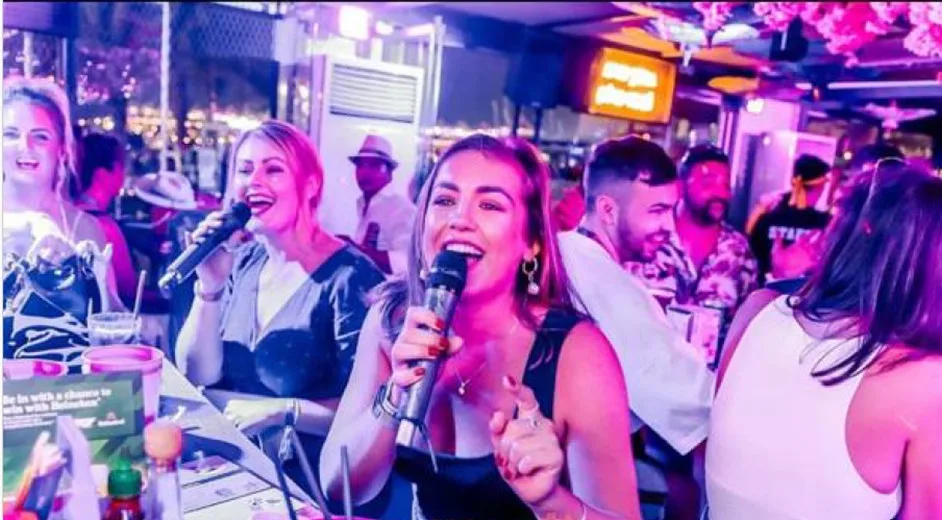 Guests singing in a karaoke session at Mr. Miyagi's